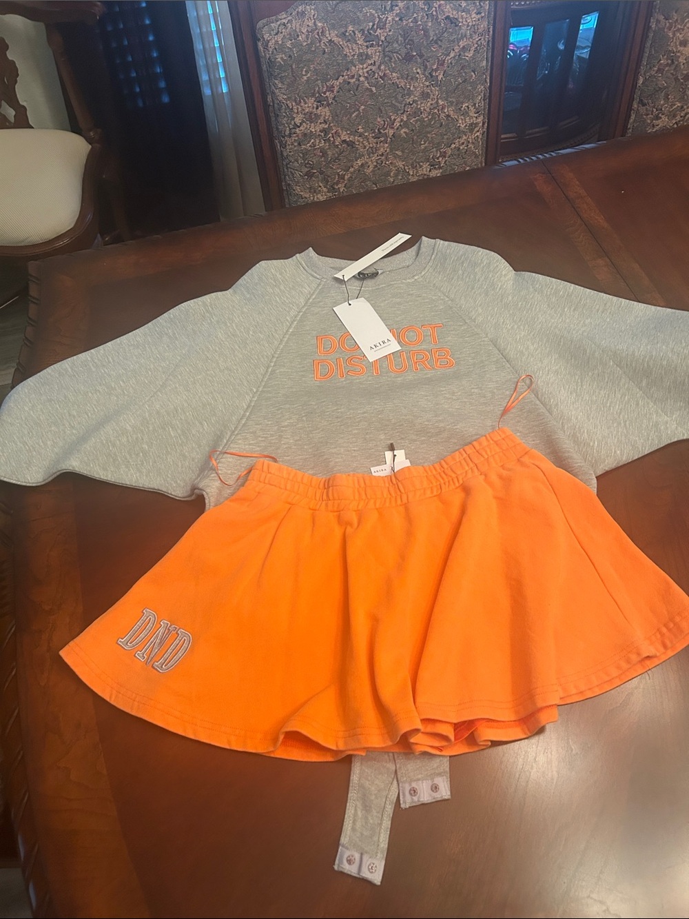Grey Do Not Disturb Crop Sweatshirt S $50
& Orange Skirt M Set skirt $40